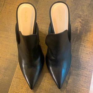 Black leather Aldo closed toed stiletto mules. Never worn. Amazing condition.